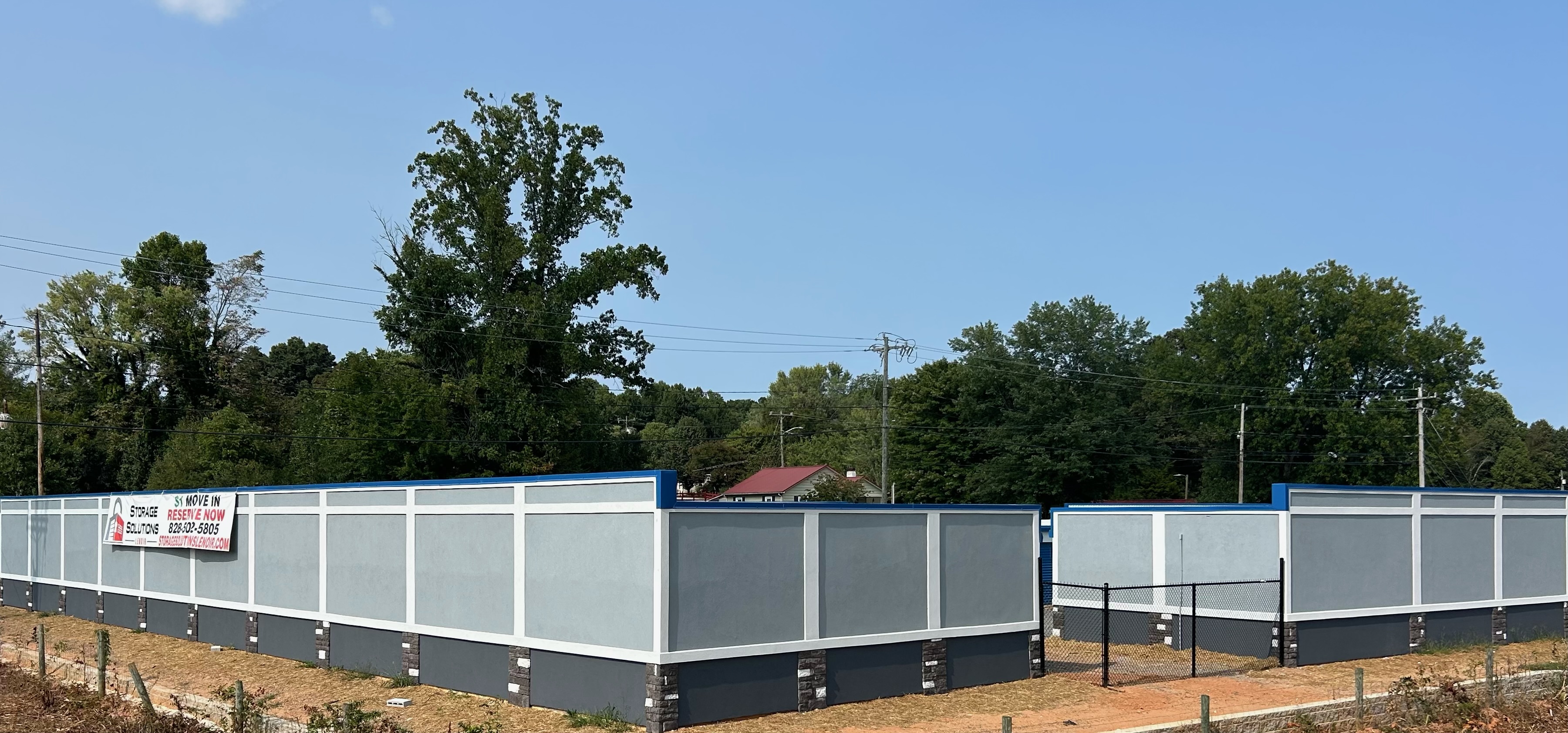 Fenced perimeter and buildings at Storage Solutions of Lenoir
